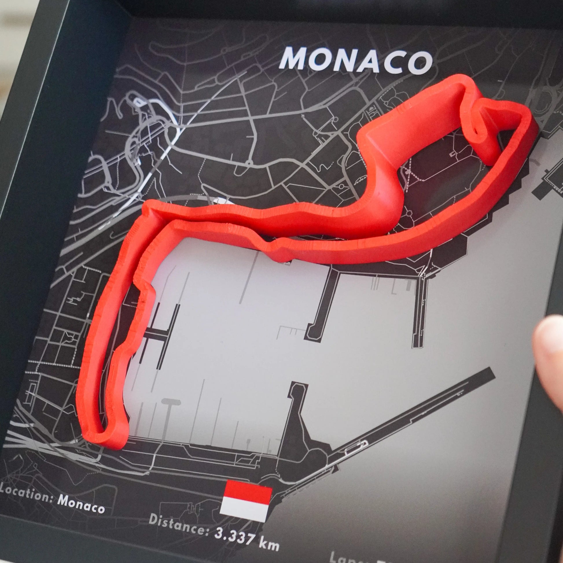 Red Monaco race track model on a map background